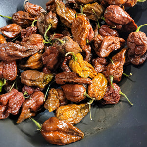 FYAH:  Fire Roasted  Chocolate-Douglah, Carolina & Scotch B Peppers. Maxed out heat & smokey intensity of flavor.